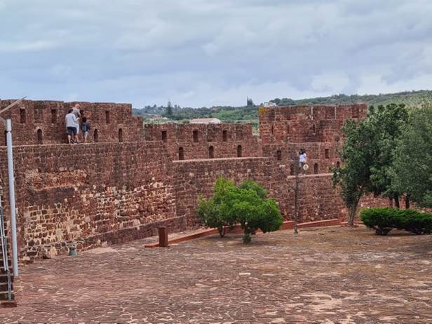 A picture containing building, sky, brick, ground

Description automatically generated