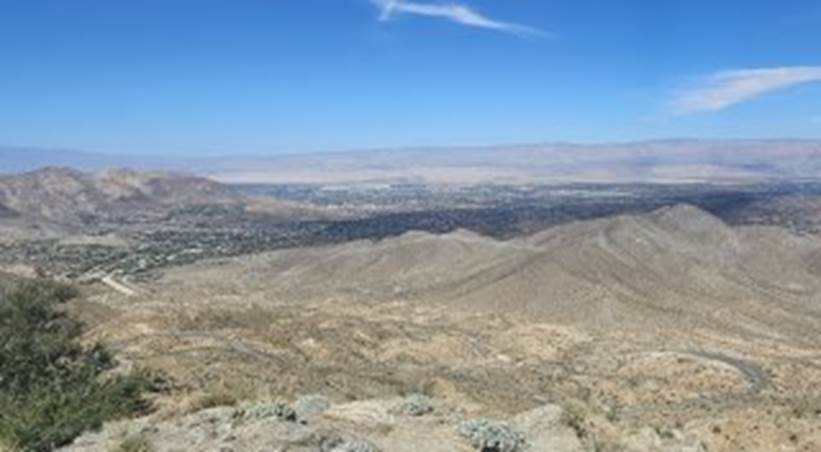 A landscape with mountains and blue sky

Description automatically generated