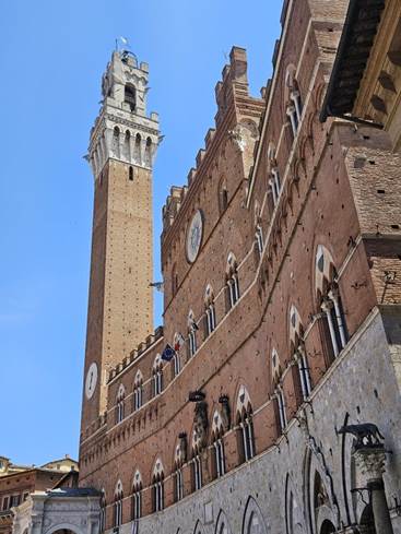 A tall brick building with a clock tower

Description automatically generated with low confidence