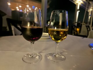 Two glasses of wine on a table

Description automatically generated