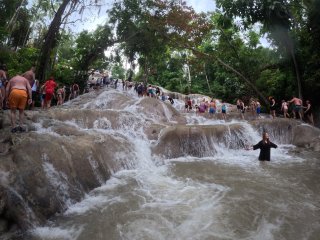 A group of people standing in a river

AI-generated content may be incorrect.