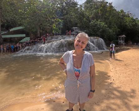 A person standing in front of a waterfall

AI-generated content may be incorrect.