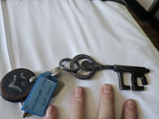 A picture containing key, indoor, keychain, scissors

Description automatically generated