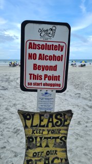 A sign on the beach

Description automatically generated with medium confidence