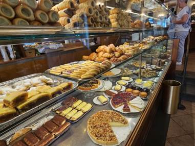 A display case of pastries

Description automatically generated with low confidence